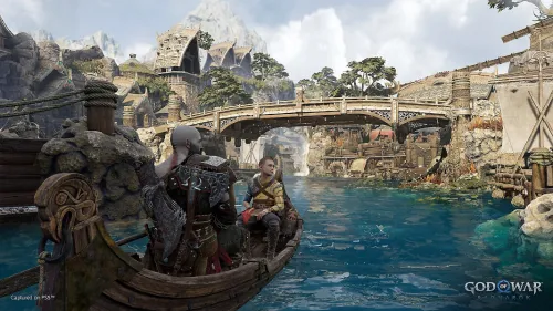 Kratos e Atreus viaggiano in barca nel regno di Svartalfheim